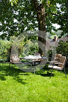 Beautiful garden with white table and chair