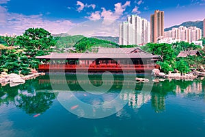 The beautiful garden with wooden house, fancy carp fish pond and building in Chi Lin Nunnery Temple and Nan Lian Garden At Kowloon