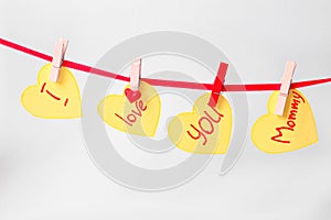 Beautiful garland made of stickers with words I LOVE YOU MOMMY on white background