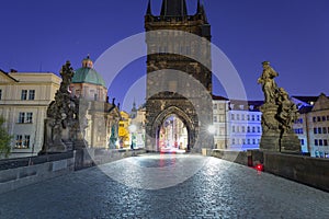 Beautiful gate to the Charles bridge in Prague at night, Czech Republic