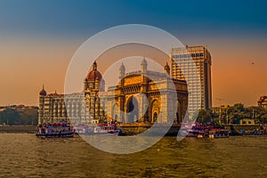 Beautiful Gateway of India near Taj Palace hotel on the Mumbai harbour with many jetties on Arabian sea