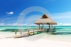 Beautiful gazebo on the tropical white sandy beach in Punta Cana, Dominican Republic