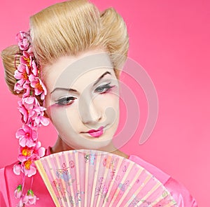 Beautiful geisha with fan