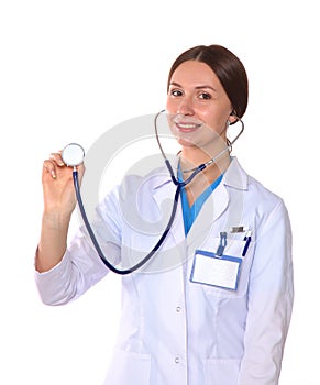 Beautiful general practitioner is working with joy. She is standing with a folder of documents in her hand