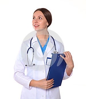 Beautiful general practitioner is working with joy. She is standing with a folder of documents in her hand