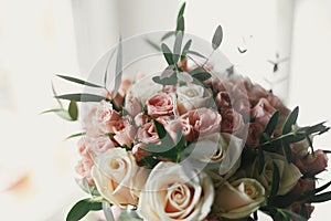 Beautiful gentle wedding bouquet with big and little pink roses
