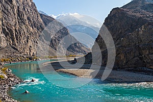 Beautiful Ghizer river in autumn season, Hindu Gush mountains range in Gilgit Baltistan, Pakistan