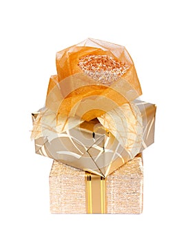 Beautiful gift box in gold paper with a silk rose isolated
