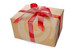 Beautiful wrapped gift box with red ribbon and bow on white background. Present for Christmas, top view