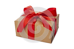 Beautiful wrapped gift box with red ribbon and bow on white background. Present for Christmas, top view