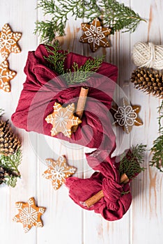 A beautiful gift packed with furoshiki technique, with gingerbread and cinnamon stick