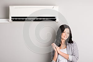 Beautiful girl and air conditioner