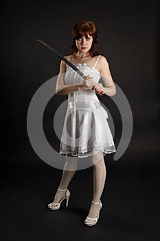 Beautiful girl armed with sword photo