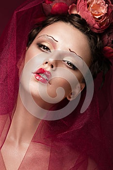 Beautiful girl with art creative make-up in image of red bride for Halloween. Beauty face.