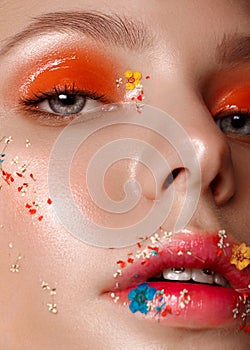 Beautiful girl with art make-up and flowers. beauty face.