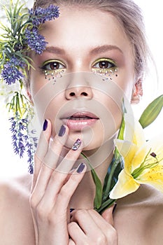 Beautiful girl with art make-up, flowers, and design nails manicure. beauty face.
