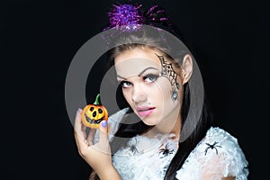 Beautiful girl art makeup with spiders