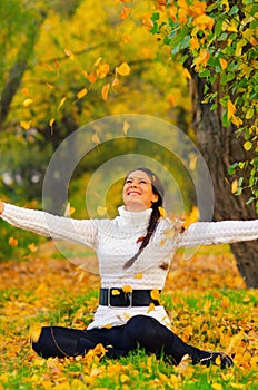 Beautiful girl in the autumn forest