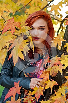 Beautiful girl in autumn scene