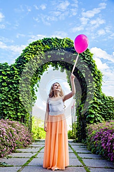 Beautiful girl with balloon have a fun in the park.