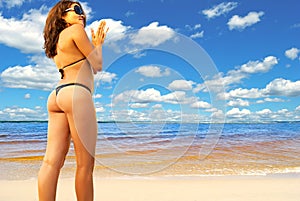 Beautiful girl in a bikini on the beach.