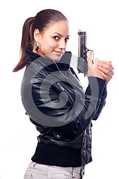 Beautiful girl in black leather jacket and beretta photo