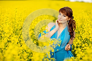 Beautiful girl in blue dress with yellow flowers