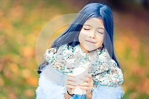 Beautiful girl with blue hair and fluffy scarf