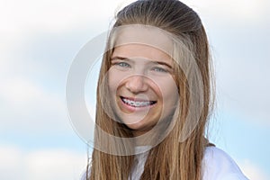 Beautiful girl with braces smiles