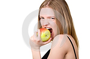 Beautiful girl with brackets eating the apple