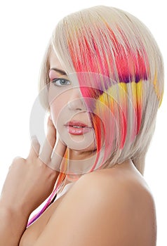 The beautiful girl with a bright make-up and multi-coloured strand in hair