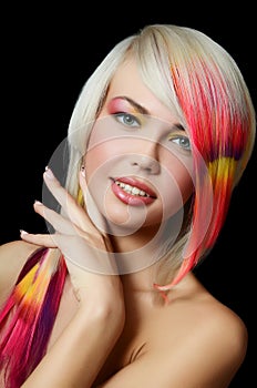 Beautiful girl with a bright make-up and multi-coloured strand in hair