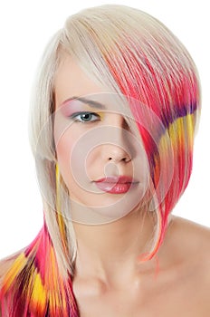 Beautiful girl with a bright make-up and multi-coloured strand in hair