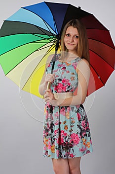 Beautiful girl with a bright umbrella