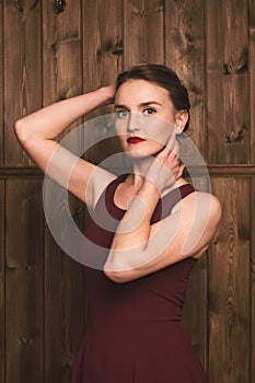 Beautiful girl in a burgundy dress