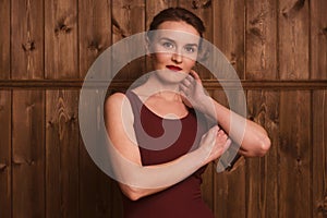 Beautiful girl in a burgundy dress