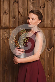 Beautiful girl in a burgundy dress