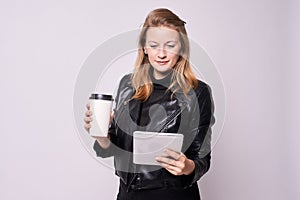 Beautiful girl. Businesswoman. Glass coffee. Computer tablet
