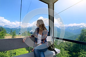 Beautiful girl in cable car. Russia. Rosa Khutor photo