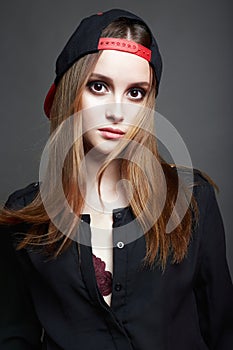 Beautiful Girl in Cap. Teenager style.Healthy Hair