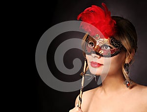 Beautiful girl with carnival mask. Halloween