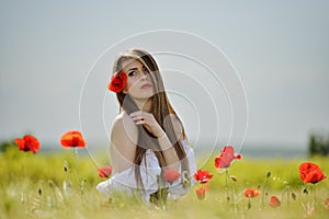 Beautiful girl on cereal field in spring