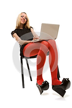 Beautiful girl in chair with laptop