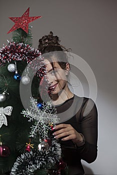 Beautiful girl and Christmas tree