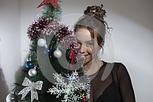 Beautiful girl and Christmas tree
