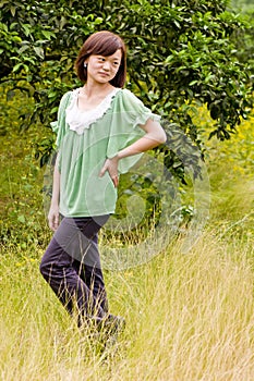 Beautiful girl in citrus orchard