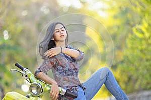 Beautiful girl with a classic motorcycle