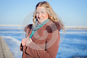 Beautiful girl in a coat in various poses