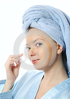 Beautiful girl with cosmetic pads in her hands