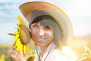 Beautiful Girl in a Cowboy Hat with Sunflowers.